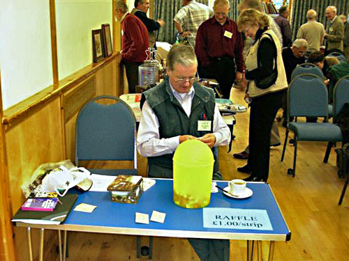 An enthusiastic volunteer selling raffle tickets (2006)